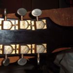 Headstock of an unknown Les Paul-style electric guitar